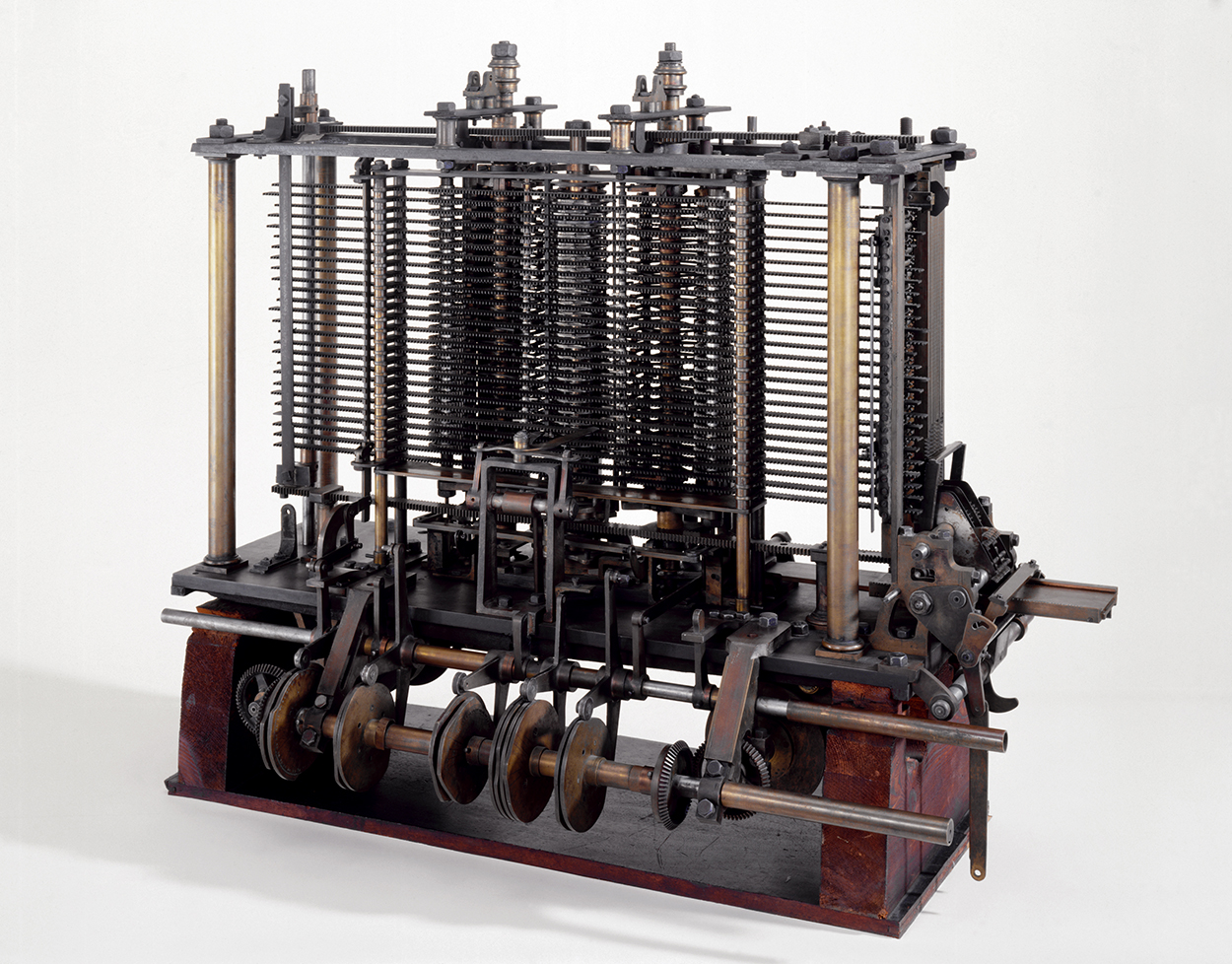 A portion of Babbage's Analytical Engine showing metal columns, gears, and a printing mechanism.